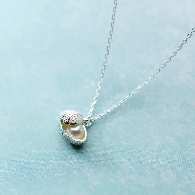 Collier de perles d'eau douce naturelles et coquillages 