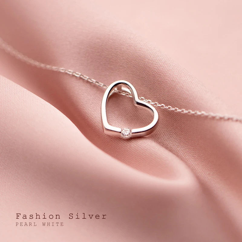 Cœur creux en zircon blanc et rose 